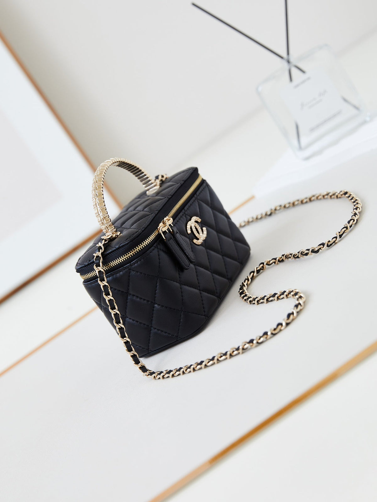 CHANEL 25S MINI VANITY BAG 16 CM IN BLACK LAMBSKIN WITH CRYSTAL-EMBELLISHED  LOGO