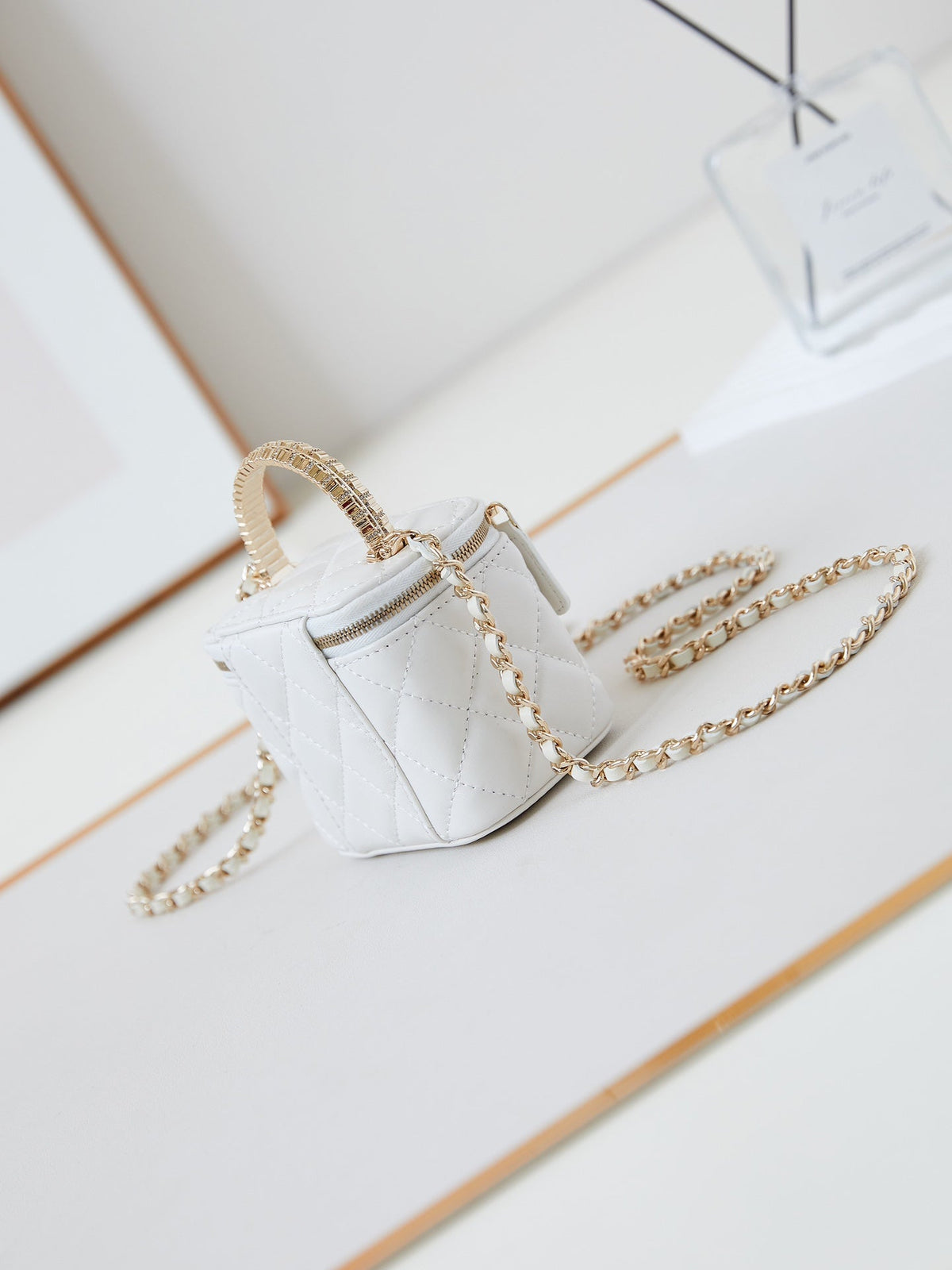 CHANEL 25S MINI VANITY BAG 11 CM IN WHITE LAMBSKIN WITH CRYSTAL-EMBELLISHED  LOGO